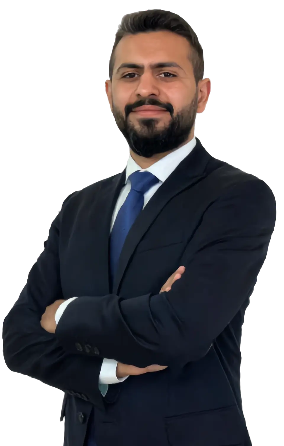 Mr. Amad Badel, chemistry teacher, in a navy suit with his arms crossed